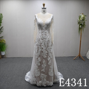 A beautiful A-line wedding evening gown with a full-body lace design
