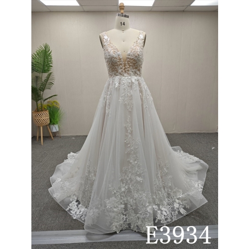 A-line wedding evening gown with a V-neck, straps, appliqués, beads