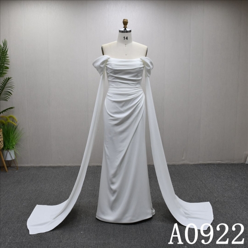 Mermaid wedding dress with off-the-shoulder sleeves, minimalist design and pleated detailing