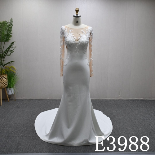 A stunning Mermaid wedding dress embellished with lace, sequins, and beads