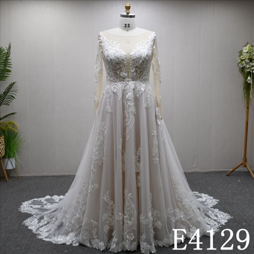 A uniquely designed and exquisite mermaid wedding evening gown adorned with lace.