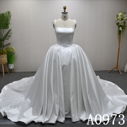 A beautiful A-line wedding evening gown with a simple pleats design with big bow