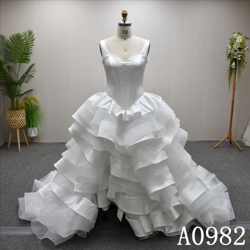 A gorgeous and unique A-line wedding dress/evening gown with a ruffled hem design.