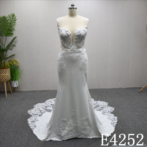 Mermaid wedding gown with a unique Sweetheart neckline and lace embellishments