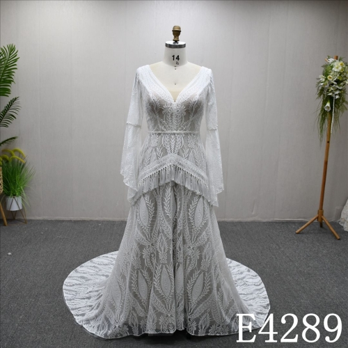 A unique and simple long-sleeved V-neck A-line wedding dress evening gown.