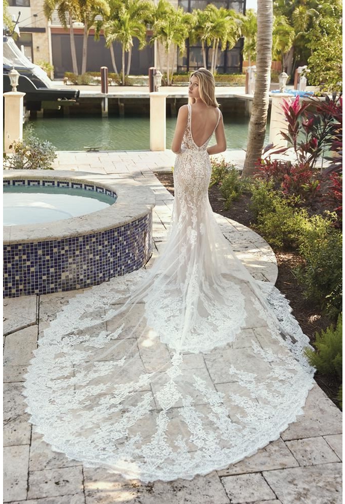 Gorgeous nude color lace mermaid gown with a beautiful train bridal dress